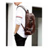 Sac à dos homme en cuir en cuir marron foncé avec multiples sangles et poches