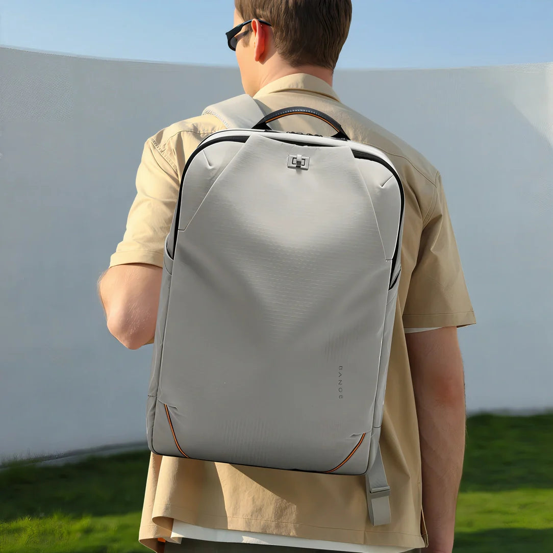 Sac à dos homme Nexar gris avec coutures rouges et fermetures argentées