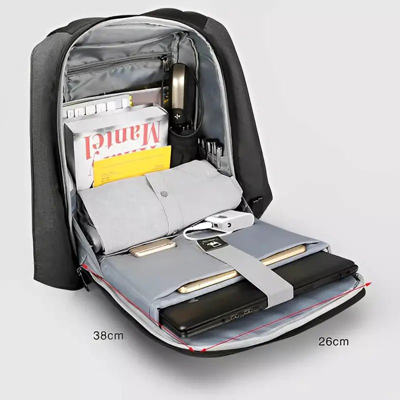 Sac à dos informatique noir ouvert avec compartiments pour électronique, documents et vêtements