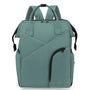 Sac à dos à langer chic en teal avec plusieurs compartiments et poignée supérieure