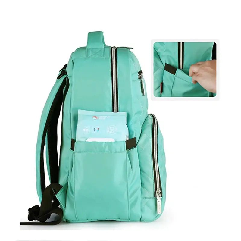 Sac à dos à langer isotherme mint vert avec plusieurs compartiments et poche latérale
