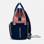 Sac à dos à langer le Queen en bleu marine et rose avec zippers dorés