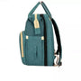 Sac à dos à langer lit teal avec accents beige et multiples compartiments