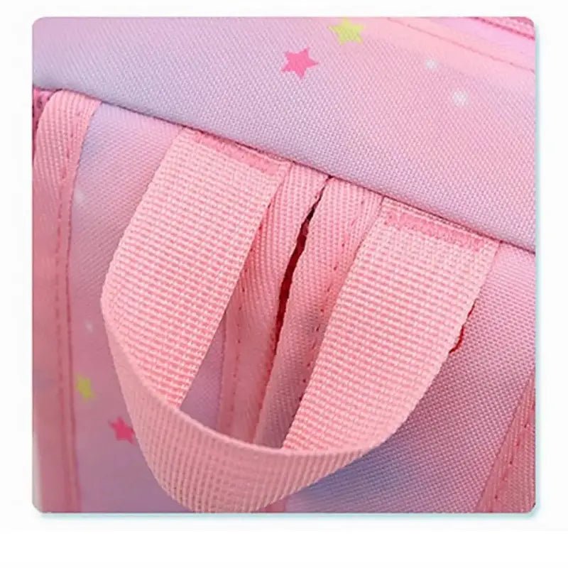 Sac à dos maternelle fille licorne en tissu rose avec étoiles colorées et poignée supérieure