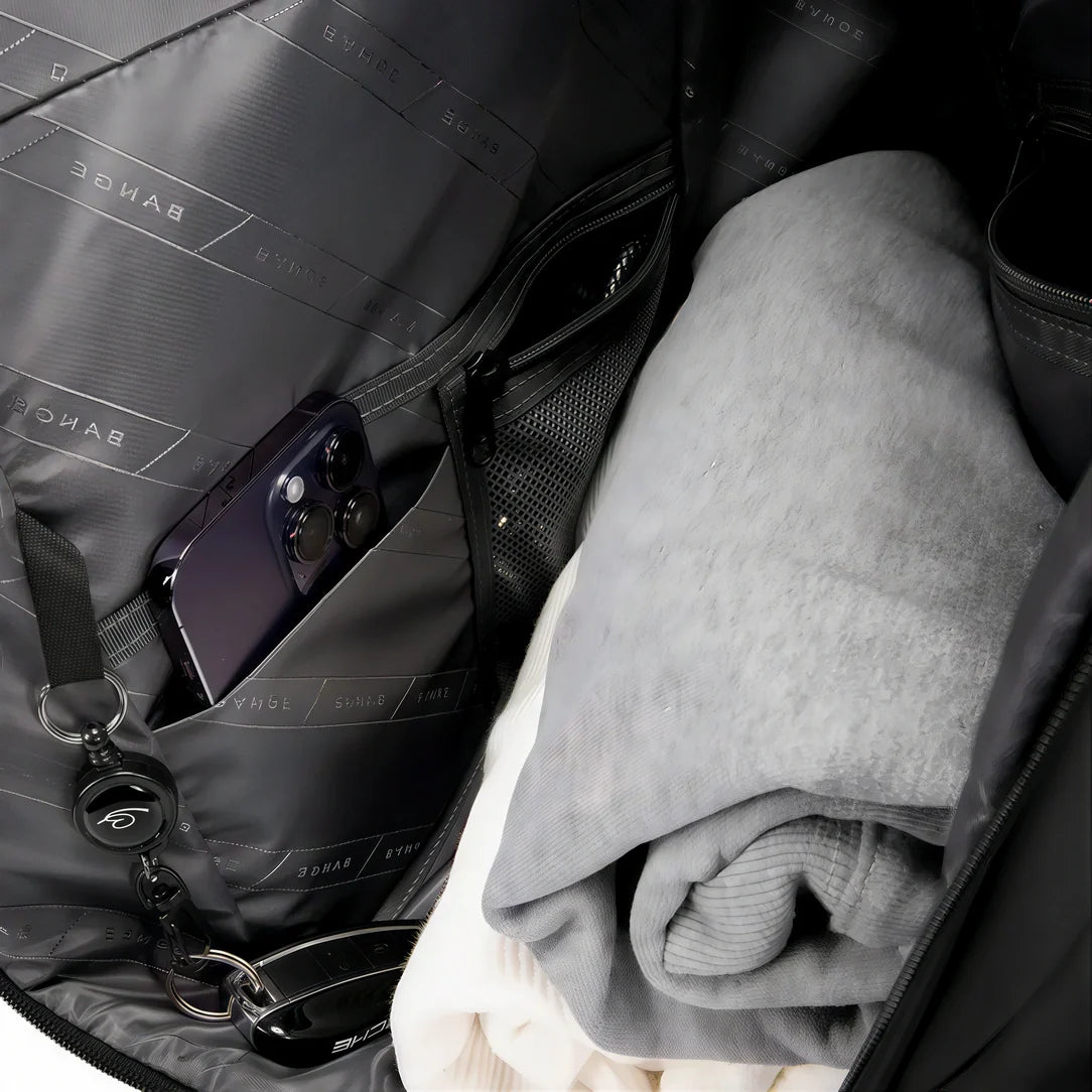 Sac à dos moderne roll top 16 pouces Calipso X avec sac de voyage noir et vêtements pliés