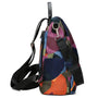 Sac à dos multicolore pour femme avec motif géométrique coloré et plusieurs compartiments