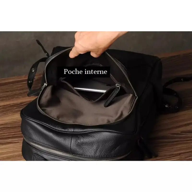 Sac à dos noir en cuir véritable avec poche intérieure zippée pour un style élégant