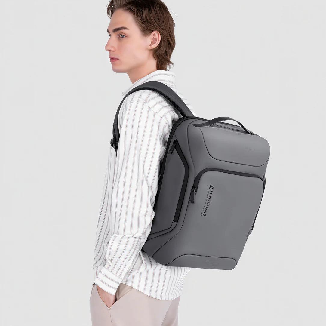Sac à dos ordinateur de voyage K10 gris avec zippers noirs et poignée supérieure