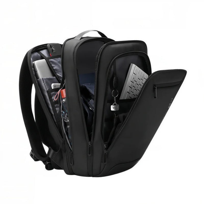 Sac à dos ordinateur Nebula 16 noir avec compartiments ouverts et contenu visible