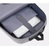 Sac à dos ordinateur usb gris ouvert avec un ordinateur portable dans la poche dédiée