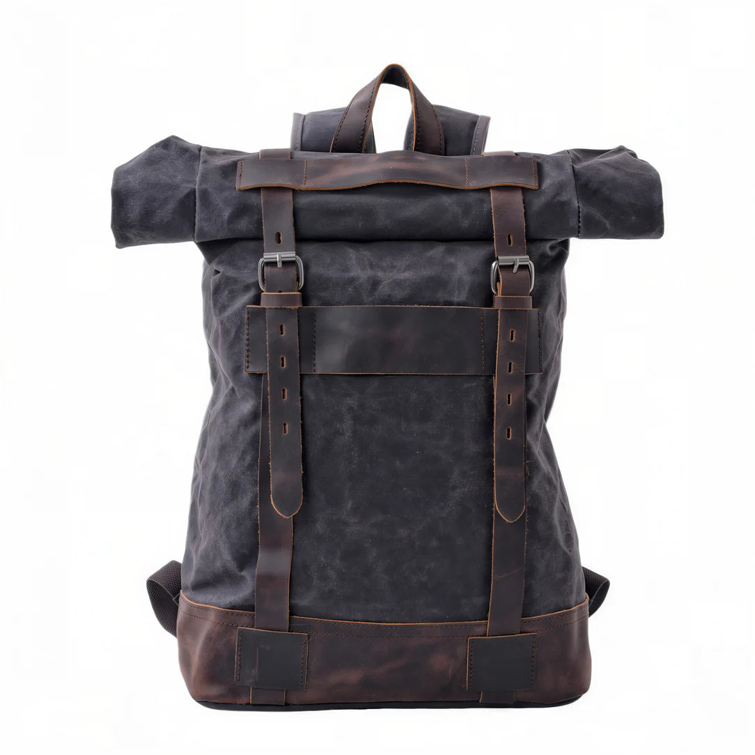 Sac à dos rétro en tissu gris foncé avec bretelles en cuir marron et base en cuir