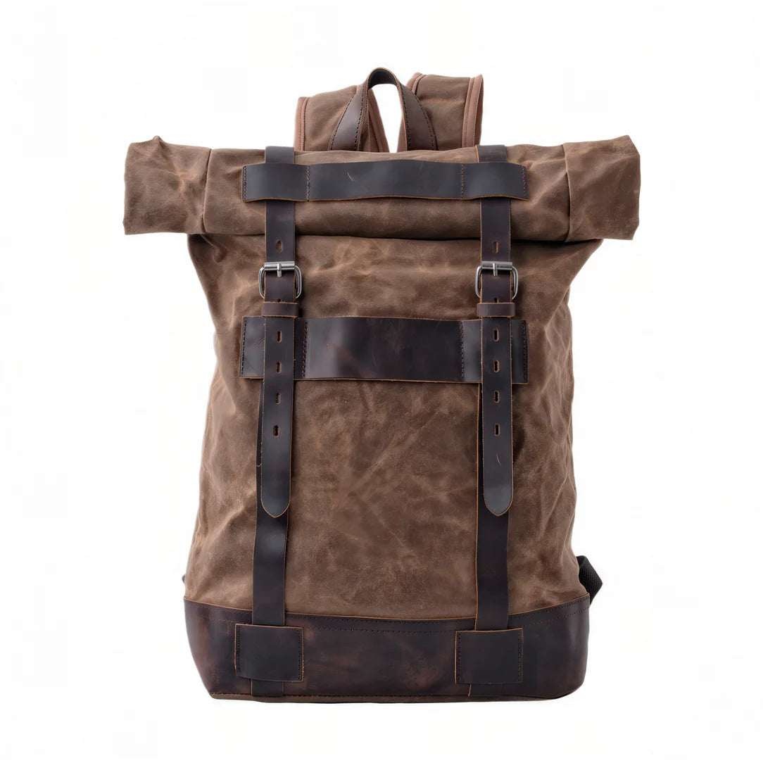 Sac à dos rétro en tissu waxé brun avec bretelles en cuir foncé et boucles