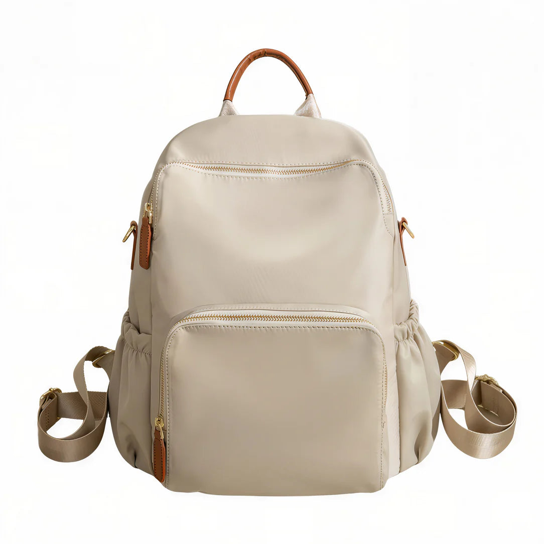Sac à dos Sable d’aube en cuir beige avec poignées et bretelles marron, plusieurs compartiments