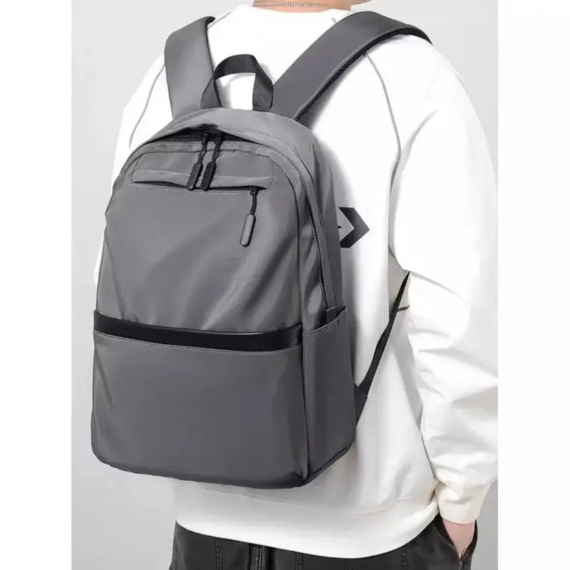 Sac à dos scolaire collège gris décontracté avec plusieurs compartiments zippés et poches latérales