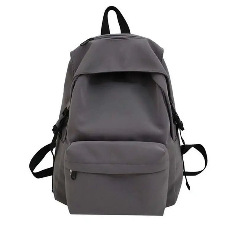 Sac à dos scolaire gris uni avec rabat frontal et poche zippée pour école