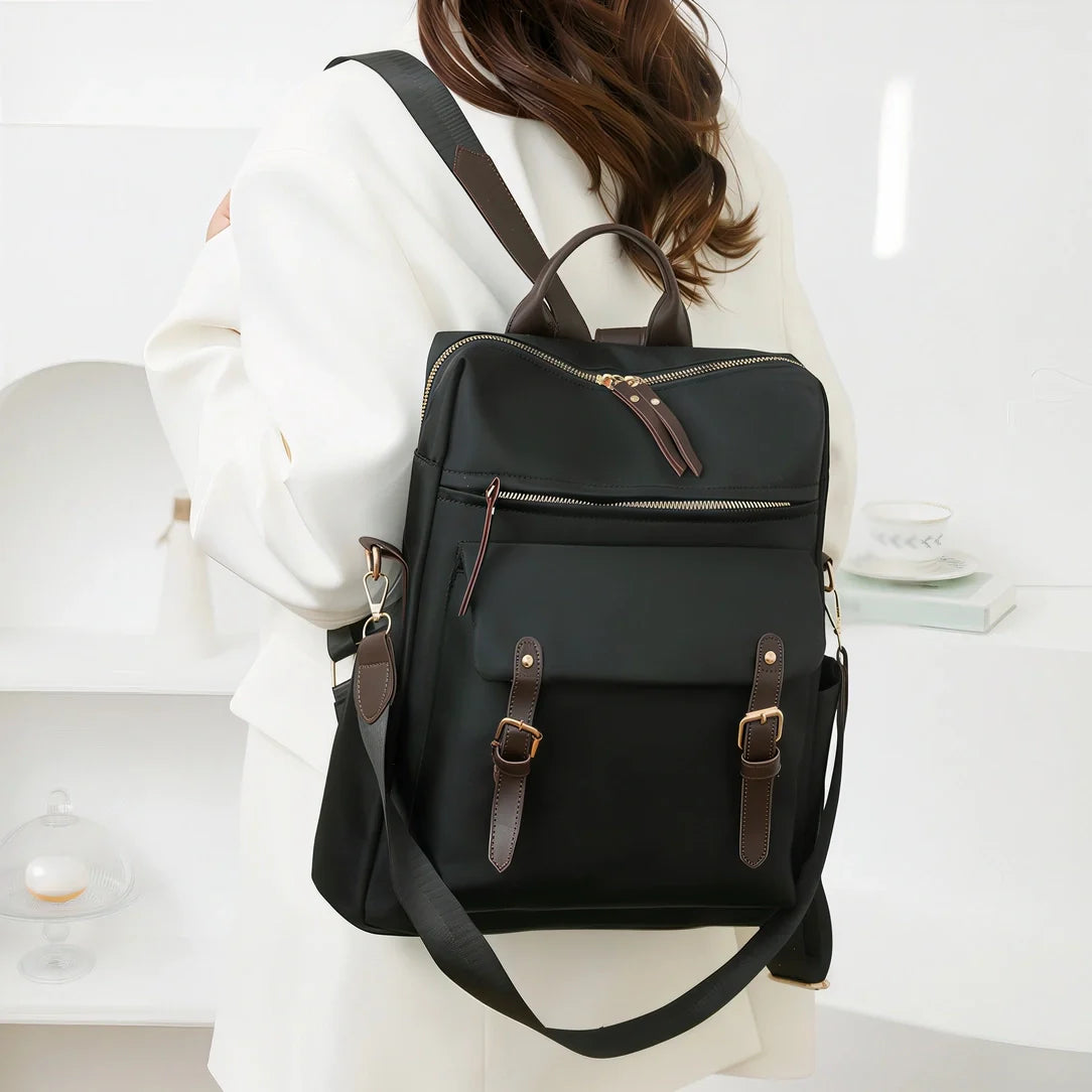 Sac à dos Sirocco en toile noire avec accents cuir marron