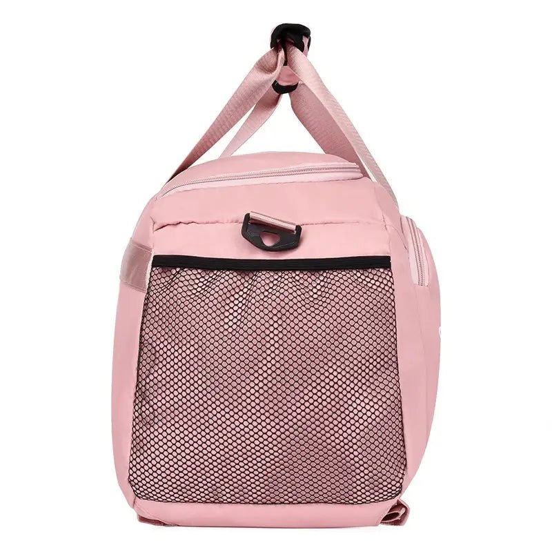 Sac à dos sport femme rose avec poche latérale en mesh pour femme