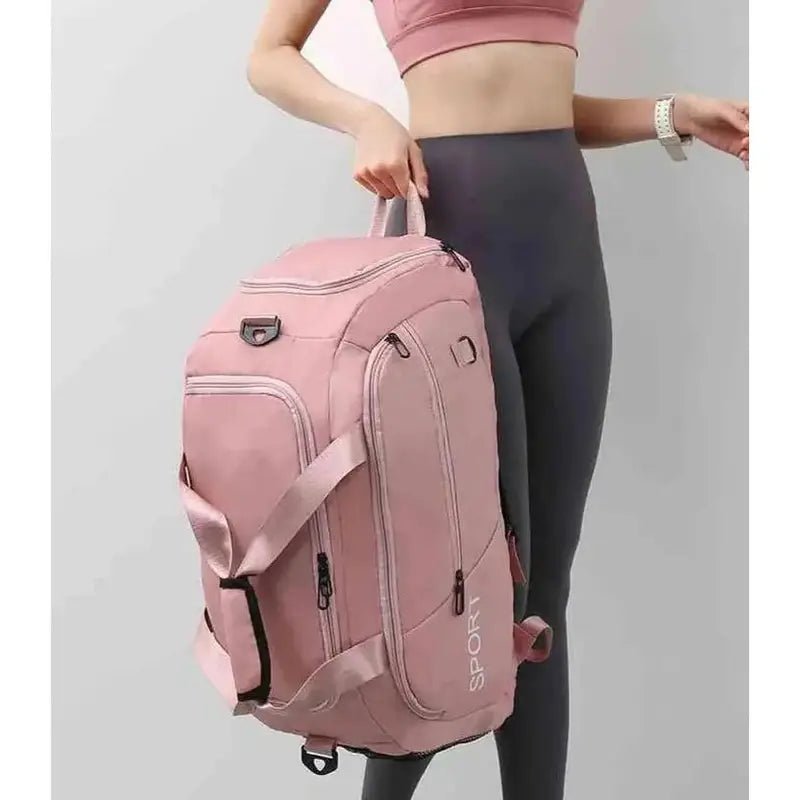 Sac à dos sport femme rose avec plusieurs compartiments et sangles pour le sport