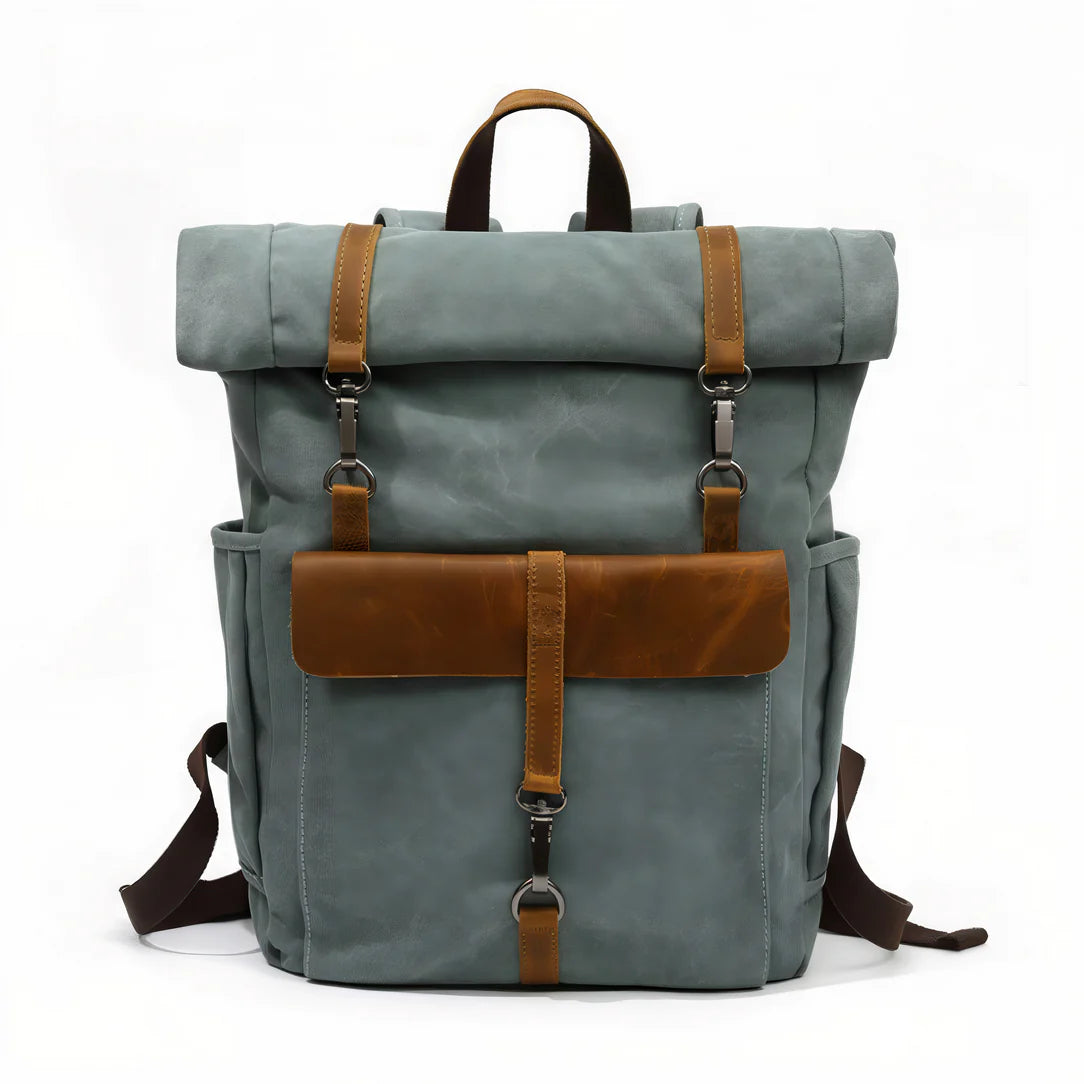 Sac à dos vintage bleu clair en toile avec accents en cuir marron et ferrures métalliques