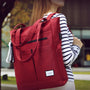 Sac à dos Tigernu Campus rouge avec accents noirs et étiquette blanche