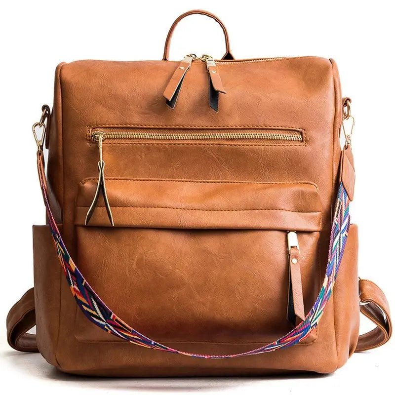 Sac à dos vintage femme en similicuir brun avec poches zippées et bandoulière colorée