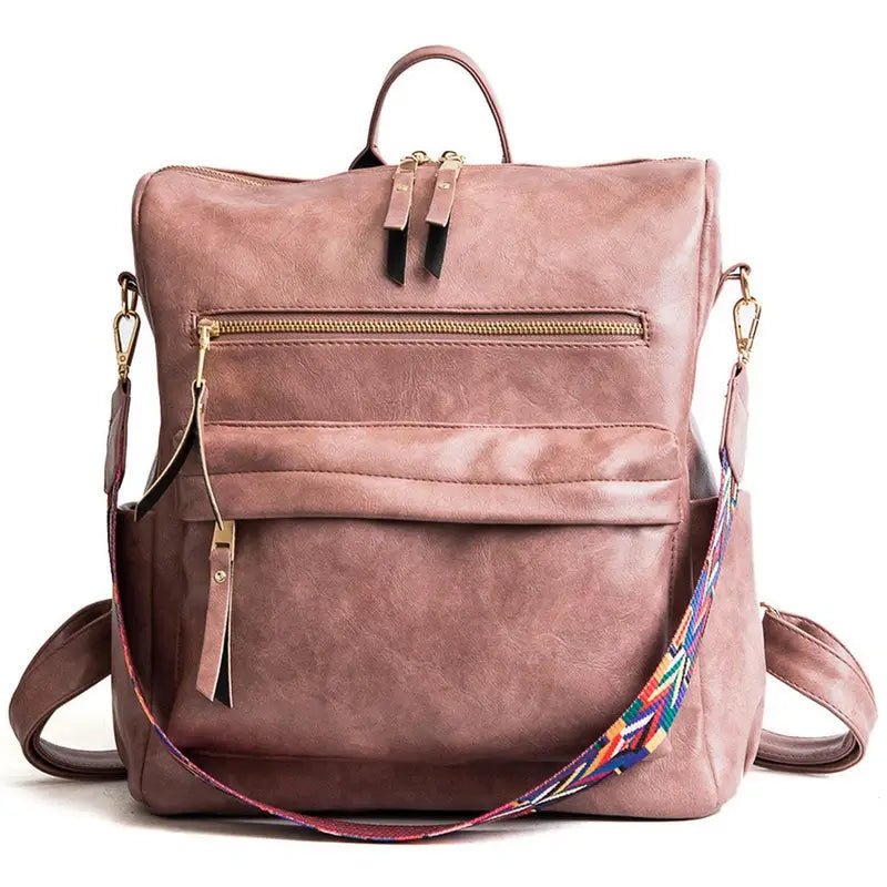 Sac à dos vintage femme en similicuir mauve avec zips dorés et bandoulière colorée