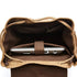 Sac à dos vintage homme en toile ouvert avec ordinateur portable à l’intérieur