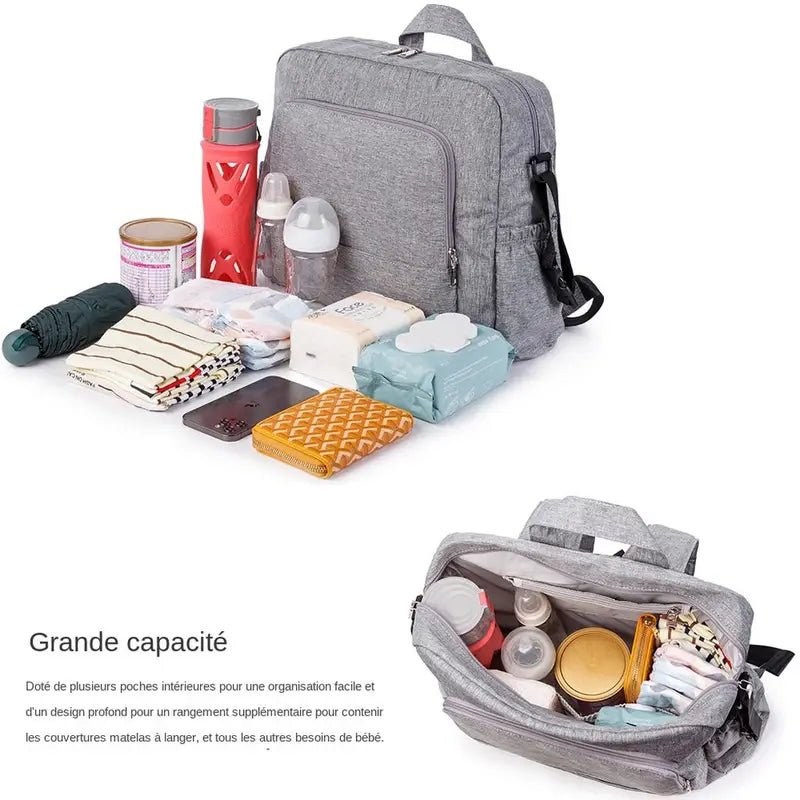 Sac à langer à dos gris avec plusieurs compartiments et articles pour bébé