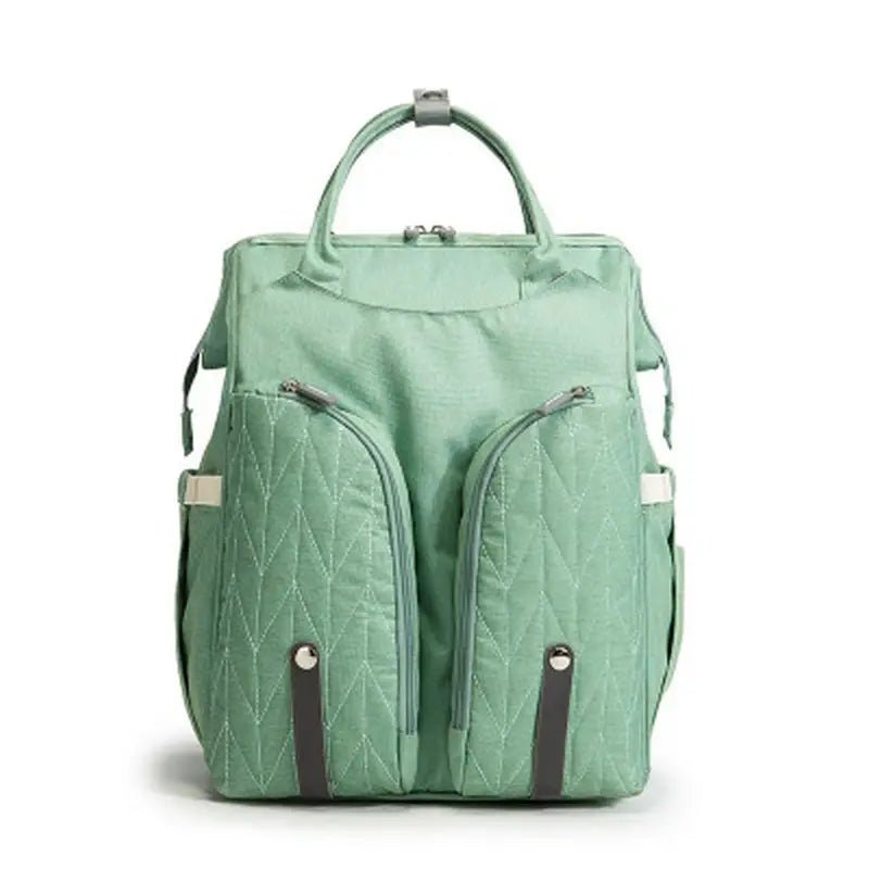 Sac à langer sac à dos lit vert clair avec poches frontales et poignées supérieures